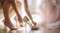 A Tender Moment as a Bridesmaid Helps the Bride with Her Wedding Shoes. Generative AI Royalty Free Stock Photo