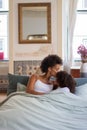Tender mother and daughter in bed Royalty Free Stock Photo