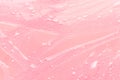 Tender pastel pink slime background with gold glitter glowing and drip lines, top view.