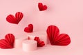 Tender pastel pink stage mockup with three round podiums, fly passion red paper hearts of asian fans in chinese style, copy space. Royalty Free Stock Photo