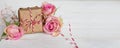 Tender pink roses with a gift Royalty Free Stock Photo