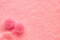 Tender pink texture of towel like background with pompons, close Royalty Free Stock Photo
