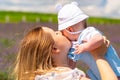 Tender portrait of a young mother kissing her baby Royalty Free Stock Photo