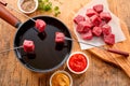 Tender prime beef being cooked in a fondue