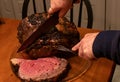 Tender rare mutton roast being served on the table