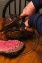 Tender rare mutton roast being served on the table