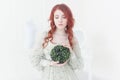 Tender retro portrait of a young beautiful dreamy redhead woman. Royalty Free Stock Photo