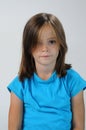 Tender schoolgirl with blue shirt Royalty Free Stock Photo