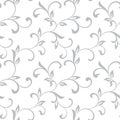 Tender seamless pattern. Tracery of twisted stalks with decorative leaves on a white background. Vintage style. The pattern can b