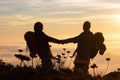 Tender silhouetted hikers at sunset Royalty Free Stock Photo