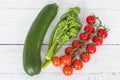 Tender stem Broccoli a small string of tomatoes and a Single Courgette Royalty Free Stock Photo