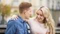 Tender student couple hugging with smiles on faces, first love story, happiness Royalty Free Stock Photo