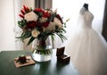 Tender weddingday. Wedding bouquet and blurred wedding dress Royalty Free Stock Photo