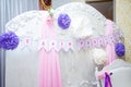 tender white photo zone with inscription on paper flags - Happy birthday. Pink curtains and purple paper flowers. Birthday party Royalty Free Stock Photo