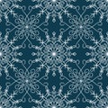 Tender winter seamless pattern with graphic snowflakes in blue and white colors