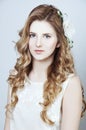 Tender young woman with long curtly blond hair Royalty Free Stock Photo