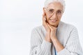 Tenderness, aging and old generation concept. Charming, elegant and kind happy senior lady, grandmother with grey combed Royalty Free Stock Photo