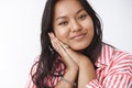 Tenderness, beauty and body positive concept. Portrait of lovely and gentle girlfriend leaning head on palms dreamy and Royalty Free Stock Photo