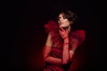 Tenderness passionate young lady posing for high fashion magazine vogue dressed red vintage trend vip gown mysterious