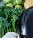 Tenderstem Broccoli and Aubergine Surrounded by  Garlic and Sprouts from the Winter Garden Royalty Free Stock Photo