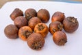 Tendu or Diospyros melanoxylon or Persimmon fruit on white surface.. Royalty Free Stock Photo