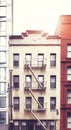 Tenement house with fire escape in Manhattan, color toning applied, New York City, USA Royalty Free Stock Photo