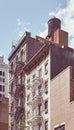 Tenement houses with fire escape in Manhattan, color toning applied, New York City, USA Royalty Free Stock Photo