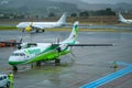 Aircraft take off, landing and boarding passengers in raining da