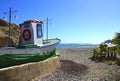 Tenerife,Canary Islands,Spain - March 15,2019:View of Tajao village with traditional old wooden fishing boat on the rocky beach.