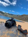 Tenerife, San Andres. Amazing composition for Travel fans with camera and island landscape on the background. Royalty Free Stock Photo