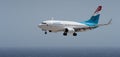 Tenerife, Spain august 2st, 2023. Boeing 737-700 of Luxair Airlines flies in the blue sky Royalty Free Stock Photo