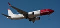 Tenerife, Spain January 3 st, 2024. Boeing 737 MAX 8 Norwegian Airlines flies in the blue sky