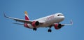 Airbus A321-271NX Iberia Express Airlines flies in the blue sky. Landing at Tenerife Airport Royalty Free Stock Photo