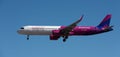 Wizz Air Airlines flies in the blue sky. Landing at Tenerife Airport Royalty Free Stock Photo