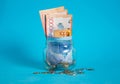 Tenge in a glass jar. Kazakhstan, KZ, KZT. Banknote, paper currency, coins, Bank. Salary, credit, savings, pay and spend. Business