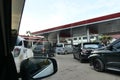 Tenggarong, Indonesia, December 2023, Cars queue line waiting for petrol in gas station Royalty Free Stock Photo