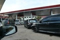 Tenggarong, Indonesia, December 2023, Cars queue line waiting for petrol in gas station Royalty Free Stock Photo