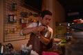 TENGGARONG, INDONESIA - MEI 2017 : Handsome barista cafe coffee preparing cup and making of coffee Service Concept for customer in
