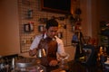 TENGGARONG, INDONESIA - MEI 2017 : Handsome barista cafe coffee preparing cup and making of coffee Service Concept for customer in