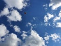 Tenis ball on blue sky with clouds