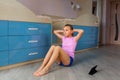 Tennage girl doing fitness gymnastics at home. Gymnastics exercises video tutorial. Children`s activity in quarantine during