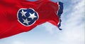 Tennessee state flag waving on a clear day