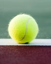 Tennis Ball on baseline of court Royalty Free Stock Photo