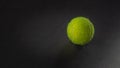 Tennis ball on black background