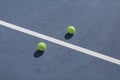 Tennis ball on blue and green hard court Royalty Free Stock Photo