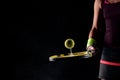 Tennis ball bouncing on racket. Dirt or magnesium dust dots visible in the air. Female player holding racket Royalty Free Stock Photo