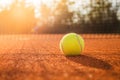 Tennis ball on a clay court Royalty Free Stock Photo