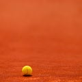 Tennis ball on clay court Royalty Free Stock Photo