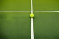 Tennis ball, court and green line texture between grass and lawn without people. Sports, empty sports training ground Royalty Free Stock Photo