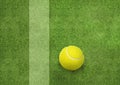 Tennis ball beside the court line Royalty Free Stock Photo